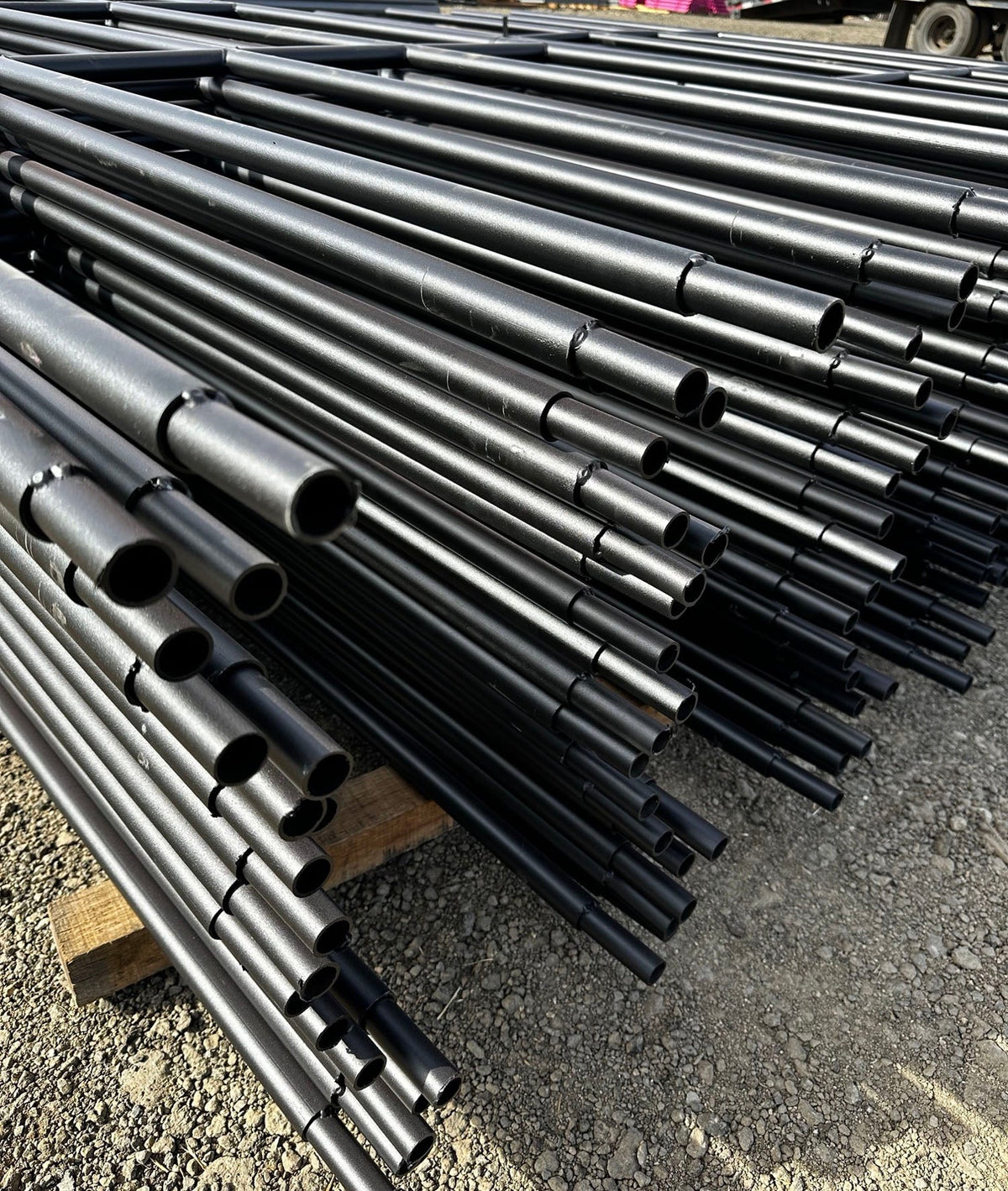 stack of powder coated continuous fence panels
